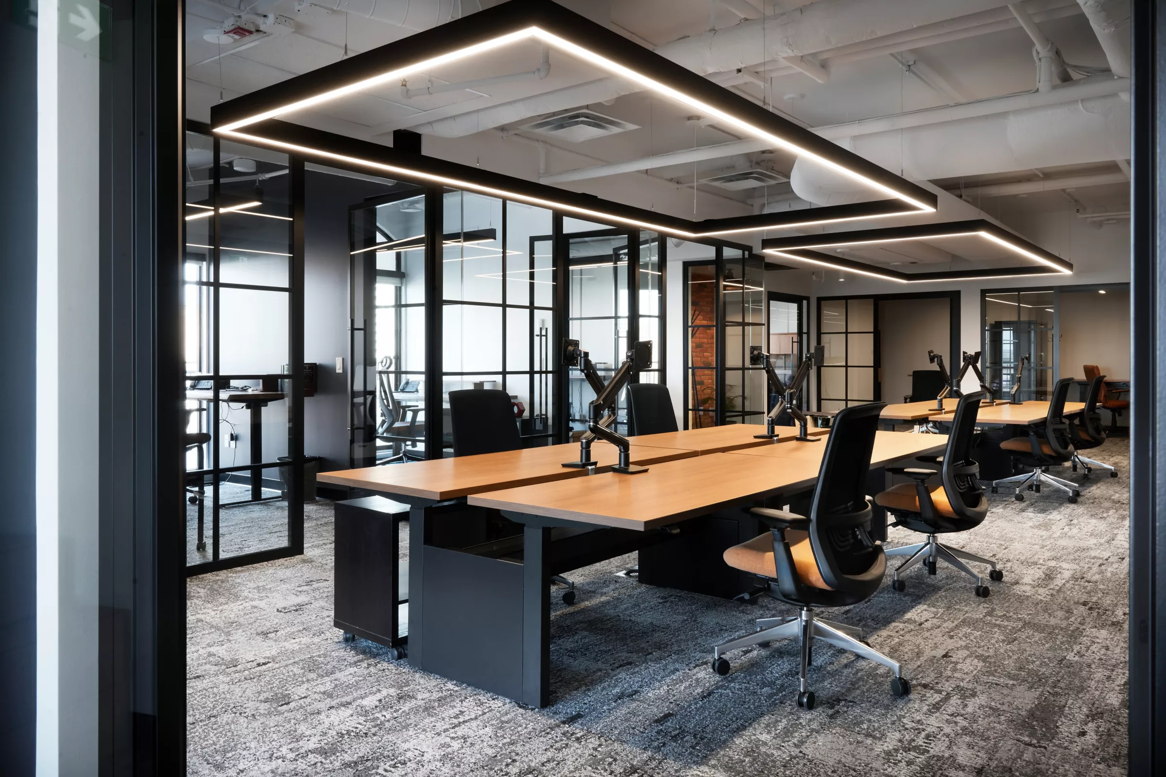 Modern office with suspended linear LED lighting